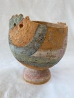 rough clay pinched and coiled pot