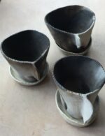 Small smoke fired flower pots with stoneware saucers