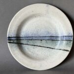 white stoneware landscape plate