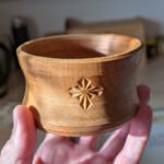 Turned and carved by hand Turned and carved by hand