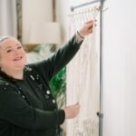 Gemma is working on a macrame curtain Gemma is working on a macrame curtain